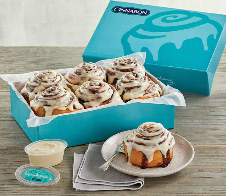 Cinnabon cinnamon rolls in their packaging.