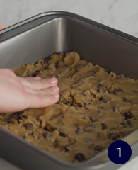 flatten cookie dough into baking pan